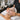A professional applying a translucent bio-cellulose mask to a client for intensive hydration in a luxury spa setting