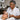 Esthetician applying a cool marble stone to clients eyebrow area after threading service in spa