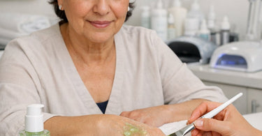 Professional esthetician applying cooling cucumber extract gel mask to client during soothing spa facial treatment at a luxury salon