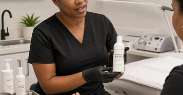 Close up of a professional applying glycolic acid foot peel treatment to client in a salon spa setting
