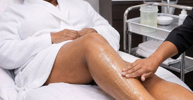 A relaxing spa treatment applying mentholated gel to soothe tired legs, showcasing the benefits for professional use at Pure Spa Direct.