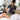 A soothing professional body treatment featuring a mud mask applied to the back, highlighting the benefits of this detoxifying spa service.