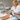 Antimicrobial spray being applied to a client's foot during a waterless pedicure service, highlighting hygiene and safety.