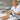 Antimicrobial spray being applied to a client's foot during a waterless pedicure service, highlighting hygiene and safety.