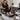 A clear disposable liner being placed into a modern, plumbed pedicure chair basin in a bright, clean salon.