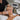 Pre-cleanse oil dissolving long-wear professional makeup on a cotton pad with spa background