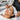Bottle of pre-tint primer being applied to eyebrows with cotton swab to remove stubborn sebum before professional tinting service
