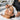 Bottle of pre-tint primer being applied to eyebrows with cotton swab to remove stubborn sebum before professional tinting service