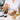 Professional pre-wax oil bottle and waxing supplies arranged on a spa table for sensitive skin care