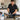 A clean and organized spa treatment room featuring a massage table with fresh linens, a UV sterilizer, and a variety of sanitized massage tools including stones, cups, and electric massagers ready for back-to-back client sessions.