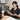 Professional bamboo massage sticks arranged on a heated towel for thermal spa therapy protocols.