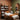 Professional waxing room setup with wax warmer, table, and organized supplies