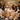 A group of happy bridesmaids in plush robes laughing together during a luxurious spa day, showcasing the perfect bridal party package experience.