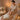 A spa professional in white gloves carefully applies a soothing gel to a client's face during a post-treatment check-in, showcasing a luxurious and caring service ritual.