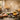 A curated selection of global spa ingredients and tools arranged on a map, including clay, salts, oils, and brushes, representing the concept of a Treatments of the World menu.