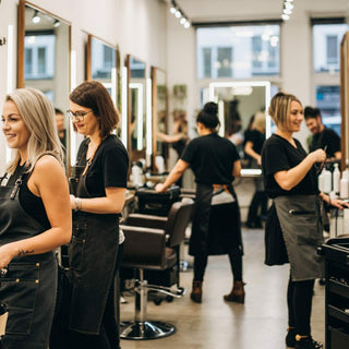 Busy modern hair salon with stylists and clients