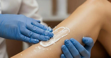 A peaceful client receiving a professional waxing treatment with numbing cream application
