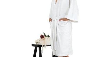 Canyon Rose Cloud 9 Microplush Spa Robe in White displayed in a luxury spa setting