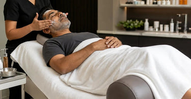 A professional spa therapist carefully positioning a supportive bolster under a client's knees during a long facial appointment to ensure optimal comfort and spinal alignment.