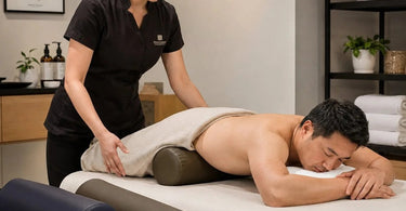 A variety of colorful massage bolsters in different shapes including half-round, round, and wedge, showcasing options for various massage positions.