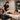 A variety of colorful massage bolsters in different shapes including half-round, round, and wedge, showcasing options for various massage positions.