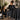A collection of professional salon capes in various lengths including floor-length and knee-length, used for cutting and chemical services. The capes are made of waterproof material and are available in multiple colors, ideal for beauty professionals.