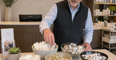 Display bowls showcasing various small spa retail products on a counter, demonstrating professional visual merchandising techniques
