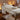 A comfortable and well-padded massage table set up in a serene spa environment