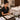 A professional and stylish assortment of spa menu inserts and service cards laid out on a spa treatment table, showcasing seasonal specials and service offerings.