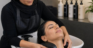 A professional salon shampoo bowl equipped with a comfortable neck cushion, highlighting client comfort and ergonomic support during shampoo services.