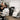 Professional makeup artist adjusting a client in a high-end adjustable makeup chair in a spa studio