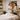 A massage therapist in a serene spa setting helps a client rebook their next appointment on a tablet, symbolizing easy client retention strategies