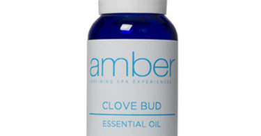 Clove Bud Essential Oil 15mL bottle by Amber Products displayed against natural background