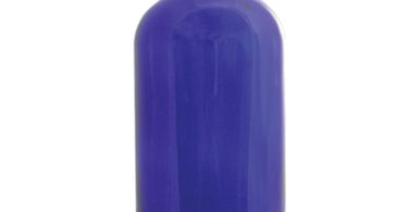 Cobalt blue glass bottle with black cap by DL Pro displayed on a white background showcasing professional spa storage for wholesale salon supplies.