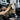 Professional hair colorist applying 8N hair color to achieve a flawless medium blonde shade
