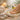 A serene spa pedicure setup featuring plush white towels, ambient lighting, aromatic scents, and professional product rituals for a luxurious yet budget-friendly experience.