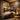 A serene and peaceful treatment room in a busy salon designed as a sensory deprivation zone, featuring soft lighting, a luxurious massage table, and calming decor to promote relaxation and client bliss.