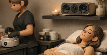 A serene spa waxing room with a smartphone displaying a music playlist next to professional waxing supplies on a clean, organized station.