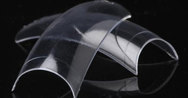Close-up image of Lamour Crystal Clear Nail Tips #03, showing their transparency and perfect shape for professional nail extensions.