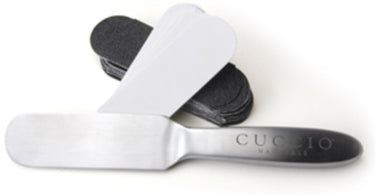 Cuccio Stainless Steel Pedicure File with disposable abrasive refills on a clean spa towel
