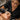 Close-up of a professional esthetician performing a dermaplaning treatment on a client's cheek, showing the precise technique and glowing skin results.