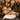 Professional barber performing a hot towel shave on a male client in a luxury grooming setting