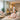 A serene spa treatment room with dim lighting, a massage table with soft linens, and a peaceful ambiance, designed to be a sensory-friendly space for neurodiverse clients.
