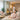 A serene spa treatment room with dim lighting, a massage table with soft linens, and a peaceful ambiance, designed to be a sensory-friendly space for neurodiverse clients.