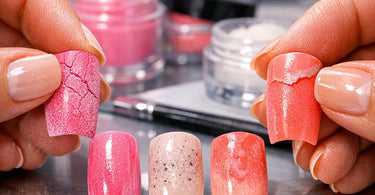 A professional nail technician performing a dip powder nail service on a client in a salon, showcasing the troubleshooting process for common dip powder issues like cracking and lifting.