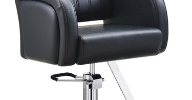 Modern DIR Anodic Styling Chair in a salon setting, showing sleek metallic frame and comfortable black upholstery.