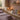 Professional esthetician performing waxing service in a modern spa setting