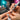 A collection of various professional e-file bits for nail drills, showcasing different shapes, materials, and color-coded grits, laid out on a clean surface, representing a comprehensive guide for nail technicians on cuticle care and safe usage.