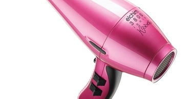 Elchim Idea Professional Hair Dryer in Vibrant Fuchsia on a salon station