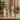 A professional spa technician confidently using a modern beauty device on a client's face in a calm, well-lit treatment room